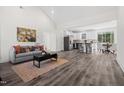 Open floor plan features living room, kitchen, and dining area with modern finishes and lots of natural light at 1915 Lambert Rd, Graham, NC 27253