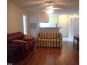 Inviting living room boasts hardwood floors and comfortable seating, flowing into the kitchen at 2000 University Woods Rd # 201, Raleigh, NC 27603
