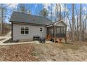 Home backyard featuring a screened porch with a classic outdoor grill at 2482 Golden Forest Dr, Franklinton, NC 27525