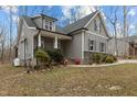 Attractive gray two-story house showcasing a classic design and manicured front yard at 2482 Golden Forest Dr, Franklinton, NC 27525