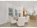 Elegant dining area featuring a glass table, stylish chairs, and natural light at 27 Silver Moon Ln # 114, Clayton, NC 27527