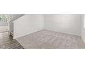 Neutral bedroom featuring a large window, carpet floors, and white walls at 40 Rolling Banks Dr, Louisburg, NC 27549