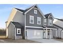 Stylish two-story home with a large two-car garage, manicured lawn, and attractive gray siding at 43 Mable Court # 4, Lillington, NC 27546