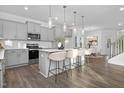 Modern kitchen with sleek gray cabinets, stainless steel appliances, and a spacious island with bar seating at 43 Mable Court # 4, Lillington, NC 27546