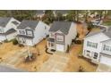 Aerial view of a well-maintained neighborhood with similar style homes, driveways and landscaping at 532 Smithridge Way, Fuquay Varina, NC 27526