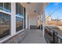 Spacious front porch featuring stone accents, iron railings, and ample space for seating and relaxation at 594 Executive Dr, Lillington, NC 27546