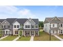 Inviting townhome exterior with covered porch and stylish architectural details at 945 Alma Railway Dr # 559, Wake Forest, NC 27587