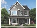 Charming two-story home with a stone facade, neutral siding, and well-manicured front yard at 945 Alma Railway Dr # 559, Wake Forest, NC 27587