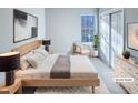 This virtually staged bedroom features a comfortable bed, modern decor, and a bright window at 101 Madeline Ct, Youngsville, NC 27596