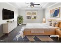 Serene bedroom featuring a large window, soft lighting, and ample closet space at 154 Magenta Rose Dr, Raleigh, NC 27610
