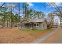 Cozy home exterior with tidy landscaping, natural light, and inviting curb appeal at 2502 Devils Racetrack Rd, Four Oaks, NC 27524