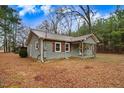 Home exterior features include tidy landscaping, natural light, and inviting curb appeal at 2502 Devils Racetrack Rd, Four Oaks, NC 27524