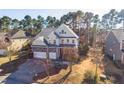 Well-maintained home with three-car garage nestled in a serene, tree-lined neighborhood at 309 Malvern Hill Ln, Morrisville, NC 27560