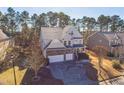Inviting home with three-car garage situated on a beautifully landscaped lot in wooded neighborhood at 309 Malvern Hill Ln, Morrisville, NC 27560