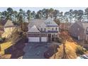 Beautiful home with three-car garage and inviting front porch in a well-maintained neighborhood at 309 Malvern Hill Ln, Morrisville, NC 27560