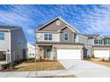 Charming two-story home featuring a brick facade, attached garage, and landscaped yard at 3505 Triad Ct, Raleigh, NC 27604