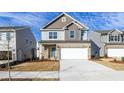 Charming two-story home featuring a brick facade, attached garage, and welcoming curb appeal at 3505 Triad Ct, Raleigh, NC 27604