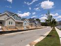 Street view of modern homes under construction with sidewalks and newly planted trees at 3928 Willow Gate Way, Raleigh, NC 27604