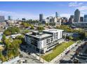 Stunning aerial view of building showing the manicured landscaping and its proximity to the city skyline at 523 S West St # 502, Raleigh, NC 27601