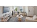 Cozy living room with a comfortable sofa, decorative pillows, and a stylish coffee table at 683 Mirkwood, Apex, NC 27523