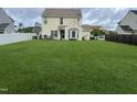 Expansive backyard featuring a well-maintained lawn and providing ample space for outdoor activities at 711 Weathervane Way, Rocky Mount, NC 27803