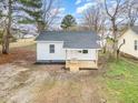 View of quaint single-story house with a covered front porch, and a clean, freshly painted exterior at 1012 E Harnett St, Dunn, NC 28334