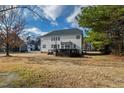 Spacious backyard featuring a dark wood deck perfect for outdoor entertainment at 1122 Virginia Water Dr, Rolesville, NC 27571