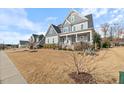 Beautiful two-story home in a desirable neighborhood showcasing manicured lawns at 1421 Sweetclover Dr, Wake Forest, NC 27587