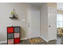 Inviting entryway with neutral walls, modern storage, and an accent rug, creating a welcoming atmosphere at 2305 Fitzgerald Ave, Durham, NC 27707