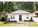 Charming single-story home featuring a newly painted exterior, manicured landscaping, and a welcoming entrance at 2305 Fitzgerald Ave, Durham, NC 27707