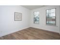 A cozy bedroom with neutral decor, hardwood floors, and natural light at 3429 Ferdilah Ln, Raleigh, NC 27610