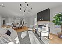 Cozy living area with a modern fireplace, stylish seating, and an open layout at 809 Tower St, Raleigh, NC 27607