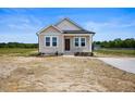 Delightful one-story home boasting a cozy front porch and attractive design at 962 Spring Hill Church Rd, Lillington, NC 27546