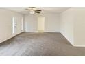 Spacious living room with plush carpeting and ample natural light at 1515 Indian Camp Rd, Chapel Hill, NC 27516