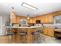 Spacious kitchen featuring an island with barstool seating and ample counter space at 161 Kerr Lake Club Dr, Henderson, NC 27537