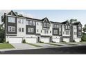 New construction townhomes, each with a two-car garage and modern exterior in a neutral color palette at 2013 Trident Maple Ln, Chapel Hill, NC 27517