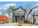 A modern home with a covered front porch, second story balcony and landscaped yard at 2212 Edwin Ave # B, Durham, NC 27705