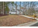 An alternate view of the house from the street, including the 2-car garage at 4436 Talcott Dr, Durham, NC 27705