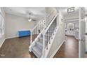 Inviting entryway with wood floors and carpeted stairs leading to the upper level of the home at 5 Bonham Ct, Durham, NC 27703