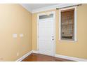 Bright entryway with hardwood floors, a white door, and natural light from the window at 532 Front Ridge Dr, Cary, NC 27519