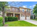 Charming two-story home featuring a stone facade, covered porch, and two-car garage at 532 Front Ridge Dr, Cary, NC 27519