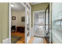 Welcoming foyer featuring a view into a study, hardwood floors and natural light at 726 Finnbar Dr, Cary, NC 27519