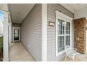 Inviting porch featuring a window with decorative trim and a charming white chair at 726 Finnbar Dr, Cary, NC 27519