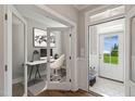 Bright entryway featuring hardwood floors, and an office with glass french doors at 15 Merle Dr, Wendell, NC 27591