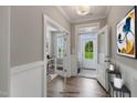 Bright entryway featuring hardwood floors, and an office with glass french doors at 15 Merle Dr, Wendell, NC 27591