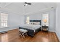 Spacious bedroom boasts hardwood floors, tray ceiling, and plenty of natural light at 1328 Wakefield Farm Rd, Zebulon, NC 27597