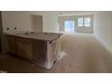 An unfinished kitchen with a wrapped island, ready to customize with your dream designs at 154 Parker Ln, Mebane, NC 27302