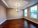 Dining room featuring hardwood floors, modern chandelier, recessed lights, and natural light at 1546 Tinos Overlook Way, Apex, NC 27502