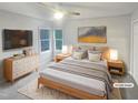This bedroom features a spacious layout, large windows, and stylish decor, creating a comfortable retreat at 206 Collegiate Cir, Durham, NC 27713