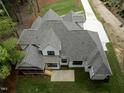 Aerial view showing the home's back porch and yard at 2410 Carpenter Pond Rd, Raleigh, NC 27613
